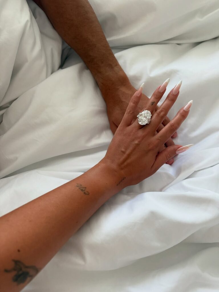 Georgina Rodriguez engagement ring from Cristiano Ronaldo proposal, showing intertwined hands with massive oval diamond